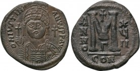 JUSTINIAN I (527-565). Follis. Constantinople. Dated RY 17 (543/4). 

Obv: D N IVSTINIANVS P P AVG. 
Helmeted, draped and cuirassed facing bust, ho...