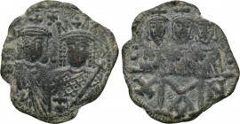 CONSTANTINE VI and IRENE (780-797). Follis. Constantinople. 

Obv: Crowned and draped facing busts of Constantine VI and Irene; between, cross above...