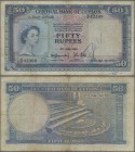 Ceylon: 50 Rupees 1952, P.52, rare banknote, small graffiti at lower center on front and lightly toned paper. Condition: F
 [plus 19 % VAT]