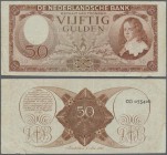 Netherlands: 50 Gulden 1945 P. 78, several folds and creases in paper, a 6mm tear at lower right, no holes and still original colors. Condition: F.
 ...