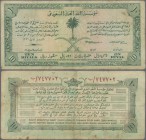Saudi Arabia: 10 Riyals AH1372 (1953) ”Haj Pilgrim Receipt”, P.1, still nice and highly rare banknote, lightly toned paper with some spots and several...