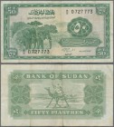 Sudan: 50 Piastres 1964 P. 7a, used with folds and creases, stained paper but no repairs, condition: F.
 [taxed under margin system]