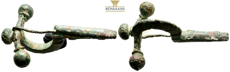 AE Roman cross-bow fibula AD 4th century. (36.5g, 74.2mm) Bronze "cross-bow" fib...