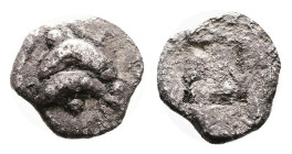Islands off Thrace, Thasos. Circa 500-480 BC. Silver Obol ( 8 mm. 0.39 g). Two dolphins swimming in opposite directions, pellets around. Rev. Quadripa...