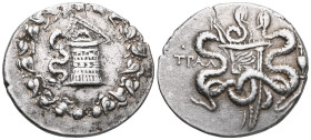 GREEK LYDIA. TRALLEIS. Cistophore . 155–145 BC. Obv.: Cistophore with a serpent in an ivy wreath with corymbs. Rev.: TPAL, two serpents coiling around...