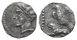 Greek Cilicia, Uncertain, AR Obol, (Silver), 4th century BC. Obv: Youthful male head left, wearing grain wreath. Rev: Eagle, with wings spread, standi...