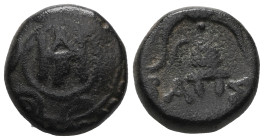 Greek Kings of Macedon, Pella, Demetrios Poliorketes (306-283 BC) AE Obv: Macedonian shield with ΔHΡ monogram of Demetrios Rev: BA-ΣI, Macedonian helm...