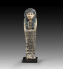 Shabti of Tel. New Kingdom, 18th dynasty, reign of Thutmose III, 1479 - 1426 BC. H 24.3cm. Limestone, polychrome painted. Probably from Deir el-Medine...
