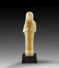 Shabti of Mentu-Imen. New Kingdom, 19th/20th dynasty, Ramesside, ca. 1292-1070 BC. Alabaster, Details painted in black and red colour. H 20.5cm. Mummy...