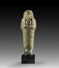 Shabti of Pa-ra-nacht. New Kingdom, 20th dynasty, time of Ramses IV. or Ramses V., ca. 1152 - 1142 BC. Basalt, H 13cm. Mummy-shaped with tripartite wi...