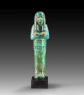 Shabti of Nefer-Her, head of Tut-anch-Amun's workshops. Faience, details in black, H 18.5cm. New Kingdom. 18th dynasty, ca. 1332 - 1323 BC. Mummy-shap...
