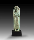 Shabti of Chaemwese, son of Ramses II. New Kingdom, 19th dynasty, ca. 1281 - 1225 BC. Turquoise Faience, H 14.8cm. The costume of the living and the p...