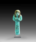 Shabti of Pa-en-ta-weret, faience, hieroglyphs in black, H 14cm. New Kingdom. 19th/20th dynasty, ca. 1292 - 1070 BC. Mummy-shaped with a tripartite wi...