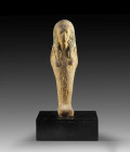 Shabti of Nes-Amun-jpet. New Kingdom, 21st dynasty, ca. 1000 BC. Red clay, rests of blue colour. H 19.2cm. Found in 1891 in Deir el-Bahari, Cachette I...