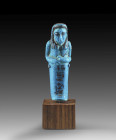 Shabti of Pasen. New Kingdom, 20th dynasty, reign of Ramses IX., ca. 1127-1109 BC. Blue faience, details in black colour. H 9.8cm. Mummy-shaped with t...