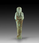 Shabti of Djehutj-rech-su, high priest of Hermopolis. Turquoise faience, H 17cm. Late Period, 30th/31st dynasty, about 664 - 332 BC. Mummy-shaped with...