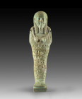 Shabti for a gentleman, usurped by a lady. Turquoise faience, H 20cm. Late period, 26th/27th dynasty, about 700 - 400 BC. Mummy-shaped with a back pil...