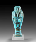 Shabti of Pa-di-Amun-neb-nesut-taui. Blue faience, H 8.3cm. Ptolemaic Period, 330 - 30 BC. Mummy-shaped with a back pillar, a tripartite wig, a beard,...