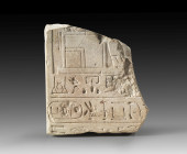 A limestone stele of Senj-res, who was major of Thebes and vizeroy of Kush during the reign of Thutmosis I. Depicted is the lower part of an enthroned...