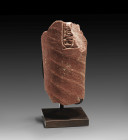 Arm of Nefertiti A fragment of the arm of an under life size statue made of red quarzite. The fragment has diagonal ribs, which show the folds of the ...