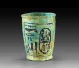 A blue fajence beaker inscribed with the cartouche of Ramses II. New Kingdom, 19th dynasty, reign of Ramses II (1279 - 1213 BC). Published 2021. Fayen...