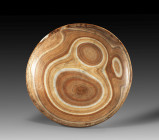 Alabaster bowl. Pre- to early dynastic period. Circa 3000 BC. ø 22cm H 3,6cm. Flat bowl with flattened base, the rim is stepped on the inside, the nat...