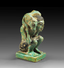 A faience figure made of a squatting man carrying a calf. New Kingdom, 19th Dynasty, reign of Ramses II. 1279 - 1213 BC. Intact. Kälbchenträger. Neues...