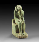Statuette of Mahet. H 11,3cm. Green faience. Third Intermediate Period, circa 900 B. C. Lion headed god on throne with hands on legs. Bumped, eyelet b...