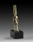 A fine electrum figurine of the god Amun wearing a short kilt, a necklace and the high feather crown with sun disk. 3rd Intermediate Period, 21. - 22....