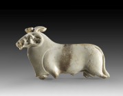 An ivory-glazed faience inlay of Amun of exceptional quality. Carved in form of a ram striding in left profile. The inlay is naturalistically modelled...