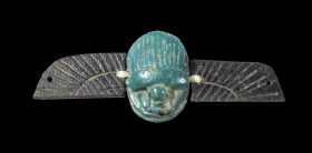 A blue faience scarab with separate black faience wings, altogether 8,4cm wide. The charming item has been in the possession of Anton Badrutt, who man...