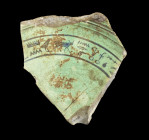 Bowl fragment wiht hieroglyphs. Late Period, 724 - 332 BC. H 8.5cm. Green faience, hieroglyphs in dark blue inlay. 'Chief physician of Upper and Lower...