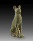 A bronze figure of a cat seated with erect ears representing the goddess Bastet, H 6cm (including the inlet pins). Third Intermediate Period / Late Pe...