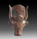 Amulet of the goddess Hathor. L 3.5cm, W 2.1cm. Made of red jasper. Depiction of the goddess Hathor in the form of a horned cow's head with a sun disc...