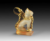 Pendant in shape of a miniature cat. H 0.7cm, W 0.9cm, L 0.8cm. Carnelian and gold wire. Goddess Bastet in form of a sitting cat on a plinth, gold wir...
