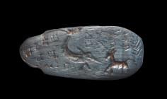 Magical gemstone made of haematite, L 3.1cm, in the shape of stylized beetle, on the underside magical inscription, crocodile, quadruped and palm bran...