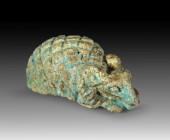 Hedgehog amulet, L 3cm made of green glazed faience. With a ram's head and an eyelet on the underside. Late Period, 7th - 1st century BC. Tiny fragmen...