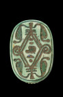 Scarab of green glazed steatite, L 2.1cm with longitudinal drilling. On the underside four reared-up uraeus serpents, in the centre the throne name Ne...
