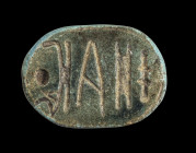 Scarab made of dark steatite with remains of blue glaze and longitudinal drilling, L 1.8cm. On the underside with the inscription Amun loves the one w...