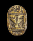 Scarab of dark steatite with remains of blue glaze and longitudinal drilling, L 1.8cm. On the underside with the two baboons of the god Chons. The thr...