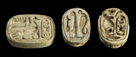 Collection of two scarabs and one amulet: a) L 1.8cm. Made of steatite with longitudinal drilling. Amulet: On the obverse with the name Thutmosis IV (...