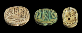 Collection of three scarabs: a) a) L 1.5cm. Made of light brown steatite with longitudinal drilling. On the underside with cartouche with the throne n...