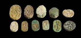 Collection of scarabs and seals:a) 6 scarabs: L 2.3 - 3.5cm. Made of steatite with longitudinal drilling, some with glaze, one piece made of faience. ...