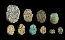 Collection of scarabs of steatite with longitudinal drilling, L 0,9 - 2.7cm. On the underside with hieroglyphs. One piece of greenish stone with smoot...