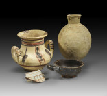 Handle amphora. New Kingdom, Amarna Period, 1351 - 1335 BC. Clay. H 11.8cm. Bulbous body with two handles. The rim is shaped outward into a broad lip....