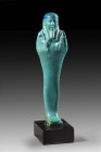 Ushabti made of blue faience. 25th - 26th dynasty, ca. 700 - 332 BC. H 12,4cm. Mounted, small chippings, otherwise intact. Uschebti aus blauer Fayence...