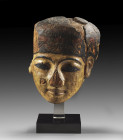Funerary mask from a sarcophagus. New Kingdom, ca. 1250 - 1150 BC. H 23.1cm and with stand 30.9cm, W 18.7cm. The middle part made of wood and the larg...