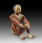 Wooden figure of a squatting man at work. Middle Kingdom, 11th - 12th Dynasty, 2134 - 1785 BC. H 18.8cm. Wood with stucco coating and painting. Naked ...
