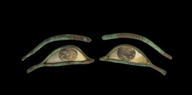 Pair of mummy eyes with extended cosmetic lines made of white limestone and bronze (L each 12,5cm), the iris in a black coloured separate material, pa...