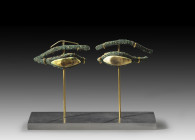 Pair of mummy eyes with extended cosmetic lines made of white limestone and bronze (L 6,5 and 7cm), the iris in a black coloured separate material, pa...